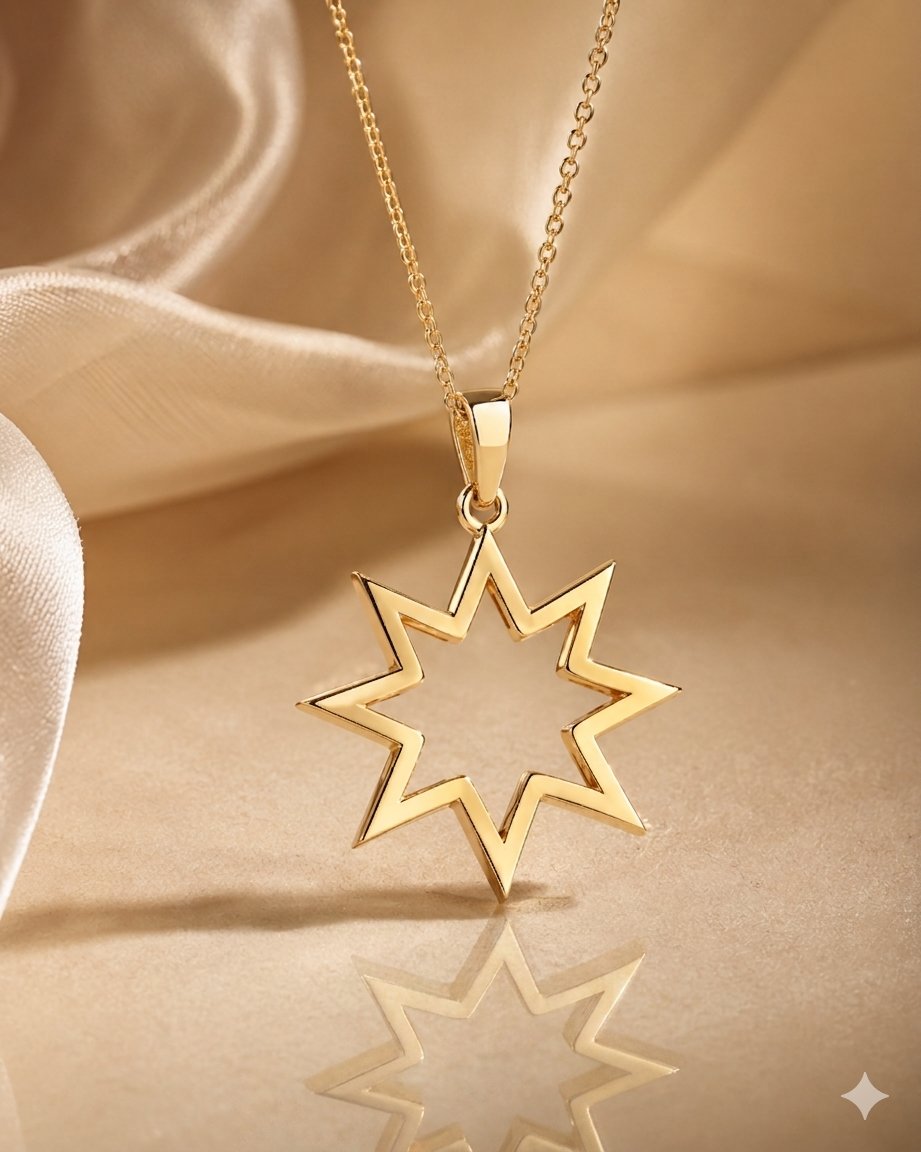 The AZZUNI Nine-Pointed Star Pendant in polished 18k yellow gold on champagne silk